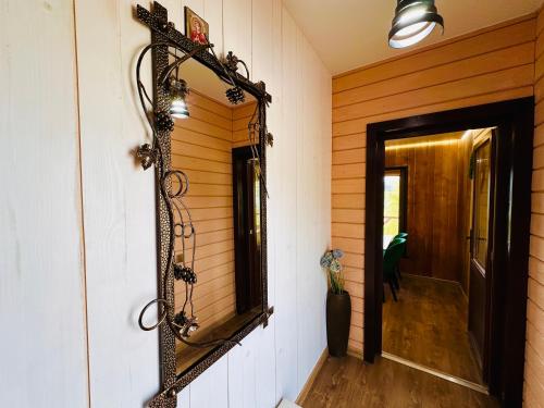a mirror hanging on a wall next to a door at Obriyslavsko in Slavske