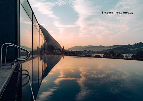 a reflection of the sky in a pool of water at Serviced Apartments by Hotel de Charme Laveno in Laveno