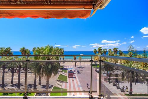 a view of the beach from a balcony at Tous Planet Costa Dorada Only Families in Salou