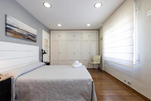a bedroom with a large bed and a window at Tous Planet Costa Dorada Only Families in Salou