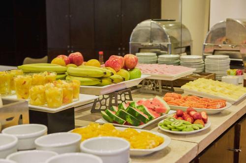a buffet with many different types of fruits and vegetables at Dazzler by Wyndham Buenos Aires San Martin in Buenos Aires