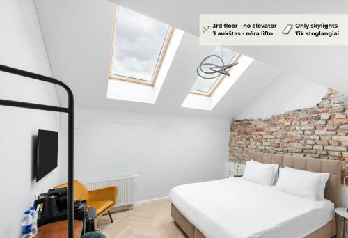 Кровать или кровати в номере St Casimir Apartments