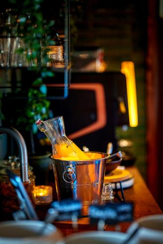 a kitchen counter with a bucket of orange juice at Best Western Hotel Botnia in Umeå