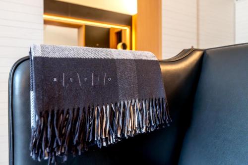 a blanket sitting on the back of a chair at Atrio in Cáceres
