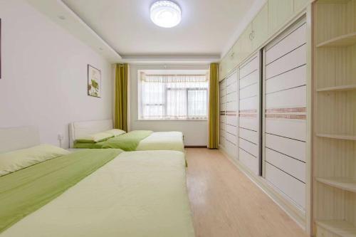 Cama o camas de una habitación en Xi Valley Apartment