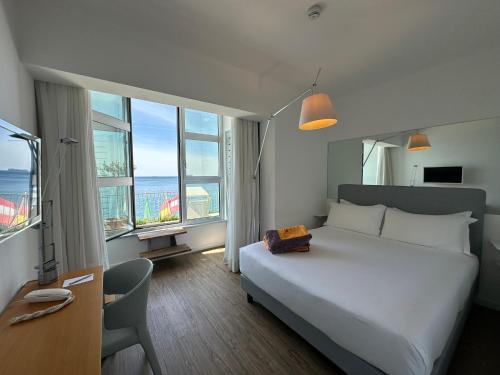 Ένα ή περισσότερα κρεβάτια σε δωμάτιο στο Hotel Miramare - Adults Only con Private Spa