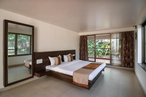 Cama o camas de una habitación en Grape County Eco Resort & Spa, Nashik