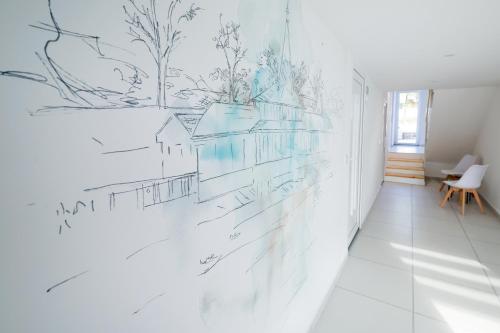 a drawing on a wall in a hallway at Villa Oliver 2 Hévíz in Hévíz