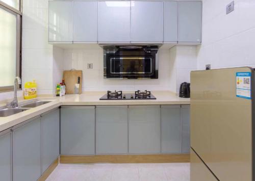 Una cocina o zona de cocina en Xi Valley Apartment