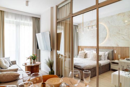 a hotel room with a bed and a table at MUSE - LoftAffair Collection in Kraków