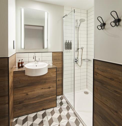 a bathroom with a sink and a shower at Residence Inn by Marriott London Bridge in London