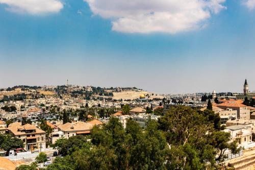 a view of a city with houses and trees at Isrentals Haneviim - ApartHotel In City Center in Jerusalem
