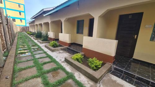 a row of plants on the side of a building at Premara Hotel Kehancha in Kinancha