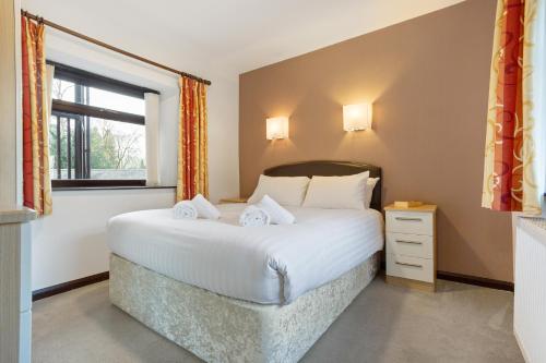 Ein Bett oder Betten in einem Zimmer der Unterkunft Hapimag Burnside Park Apartments