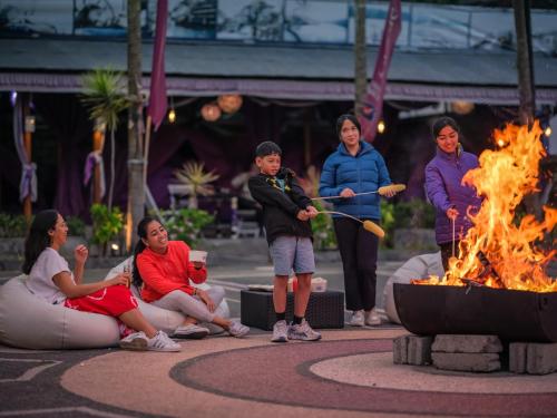a group of people standing around a fire pit at Hiker's Camp at Toya Devasya in Kintamani