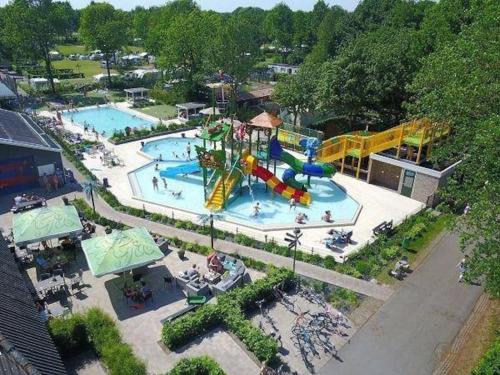 an aerial view of a water park with two pools at De pallegarste chalet 119 in Mariënberg