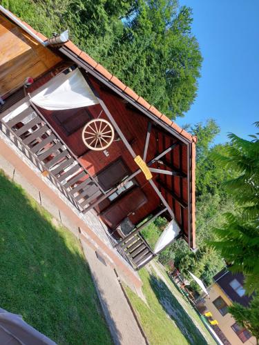 an overhead view of a building with an umbrella at Dor de Munte Transfăgarasan in Cîrţişoara
