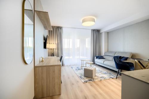 a living room with a couch and a table at AboutArtApartments - Otyńska 4 in Wrocław