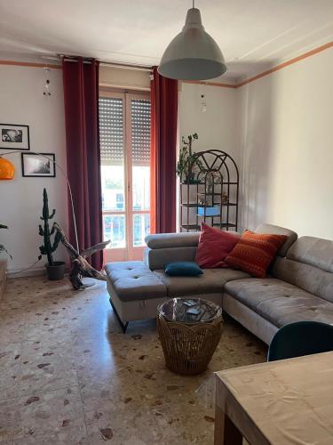 a living room with a couch and a table at Casa GIULIVA in Alessandria