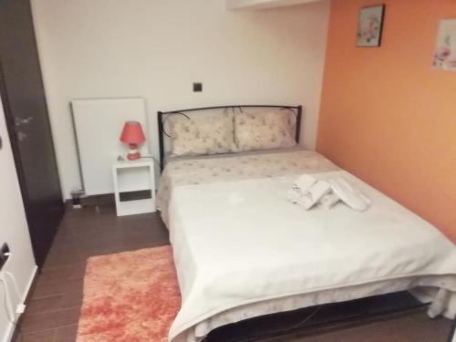 a bedroom with a bed with a teddy bear on it at Optasia Luxury House in Argos