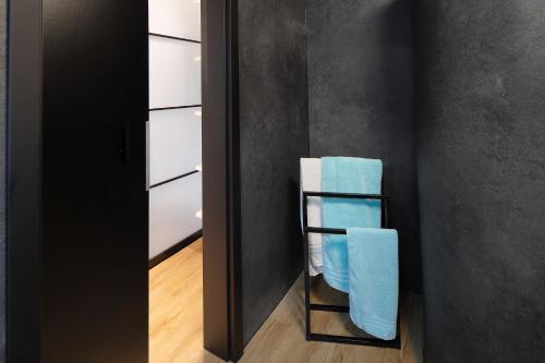 a bathroom with a towel rack in a room at Happy Place in Ilmenau