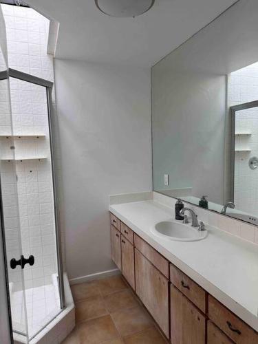 a bathroom with a sink and a mirror at 30 PCT OFF!! Limited Time! Malibu Ocean Wave with King Bed, Walking to Beach and Hiking in Malibu