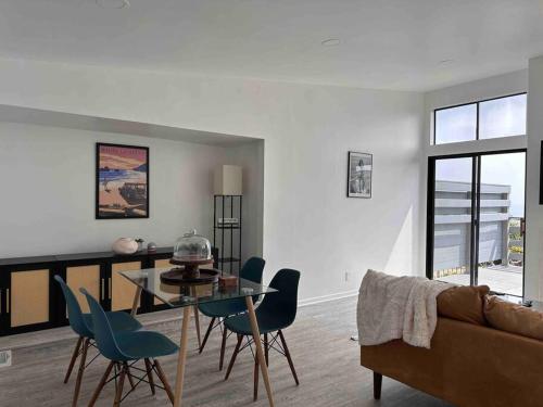 a living room with a table and chairs and a couch at 30 PCT OFF!! Limited Time! Malibu Ocean Wave with King Bed, Walking to Beach and Hiking in Malibu
