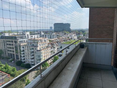 a balcony with a view of a city at Business Apartment SPA walk to Fair & Rhine River in Düsseldorf