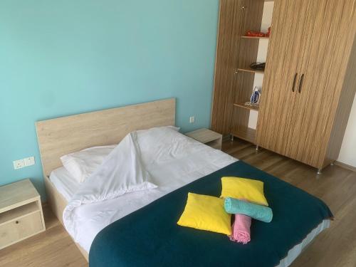 a bedroom with a bed with two pillows on it at Nice Flat in Caesar in Iskele