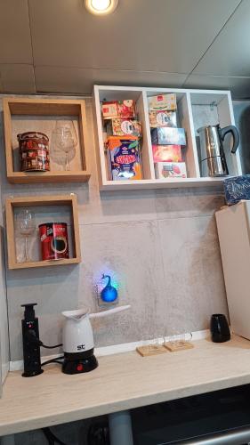a kitchen counter with shelves and a blender on it at Nitro Inn 1 Premium Cozy - Wine Tasting - Souvenir - Art Gallery - Private Guided Tours - Relaxing - Romantic in Skopje