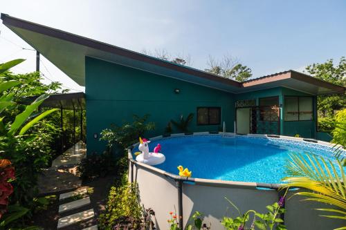 a house with a swimming pool in front of it at Vacation Home Bartenderluisch in Fortuna