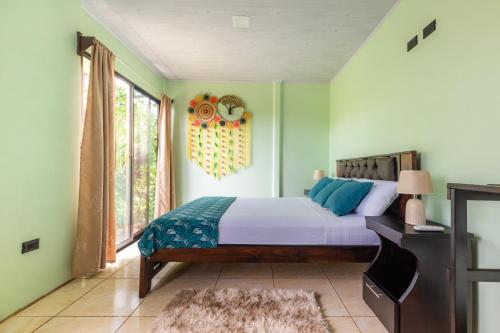 a bedroom with a bed and a window at Vacation Home Bartenderluisch in Fortuna
