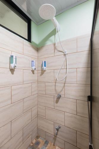 a bathroom with a shower with wooden walls at Vacation Home Bartenderluisch in Fortuna