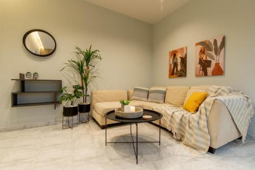 a living room with a couch and a table at Grande Terra in Kiotari