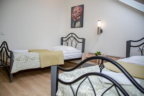 Postel nebo postele na pokoji v ubytování Hotel Pas Katina