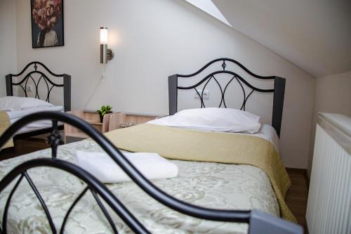 Postel nebo postele na pokoji v ubytování Hotel Pas Katina