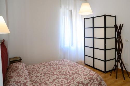 Ένα ή περισσότερα κρεβάτια σε δωμάτιο στο Piazza Roma Apartment