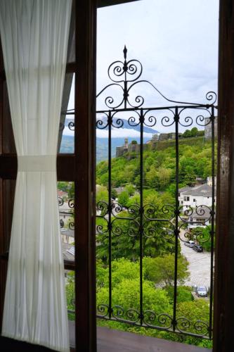 a window with a view of the ocean at Emblematic House Apartment 2 in Gjirokastër