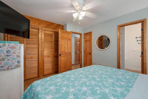 a bedroom with a bed and a ceiling fan at KH195 Just Wright in Kitty Hawk