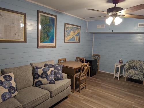 a living room with a couch and a table at KH195 Just Wright in Kitty Hawk