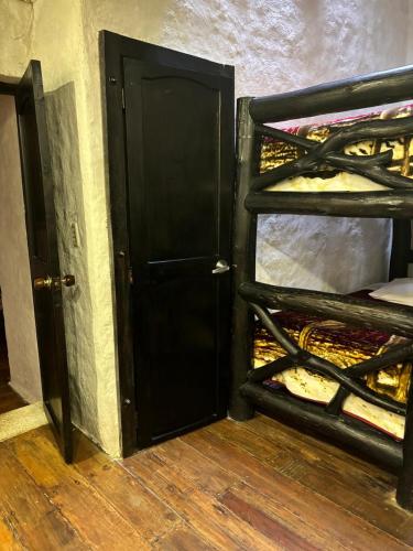 an open door to a room with a shelf of bread at Finca Campestre La Adelita B&B in Salento