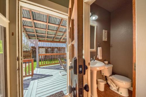 a bathroom with a toilet and a balcony at DT 292 Star Haus in New Braunfels