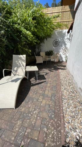 a group of benches sitting on a patio at Beas Ferienglück in Busenberg