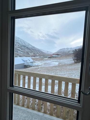 a window with a view of a snowy field at Wilderness Center / Óbyggðasetur Íslands in Óbyggðasetur
