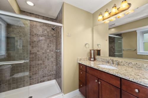 a bathroom with a shower and a sink at SH101 Reel Catch in Southern Shores
