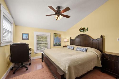 a bedroom with a bed and a ceiling fan at SH101 Reel Catch in Southern Shores
