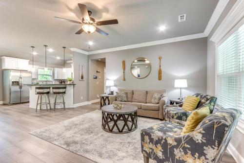 a living room with a couch and a table at Eureka Springs Family Home - half Mi to Marina! in Eureka Springs