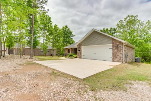 a house with a garage with a driveway at Eureka Springs Family Home - half Mi to Marina! in Eureka Springs