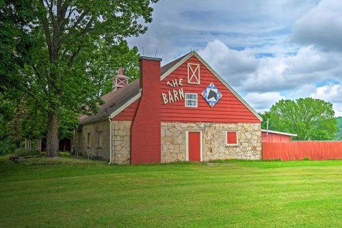a red barn with a sign on the side of it at Eureka Springs Family Home - half Mi to Marina! in Eureka Springs