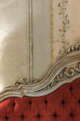 an ornate gold frame on a wall with a mirror at Hotel Villa Sermolli in Borgo a Buggiano